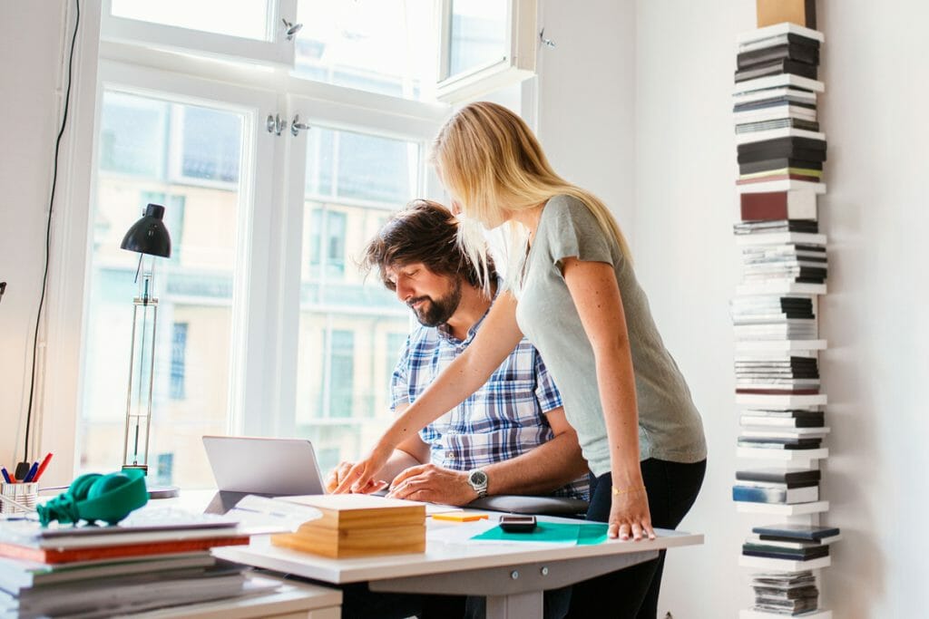 Two team members work on digital marketing project